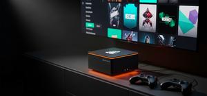 AI-generated editorial hero image of a compact SteamOS gaming cube under a TV, surrounded by controllers, orange neon accents, and subtle cyan Linux-inspired interface details.